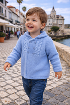 Baby cardigan in knit fabric with hood.